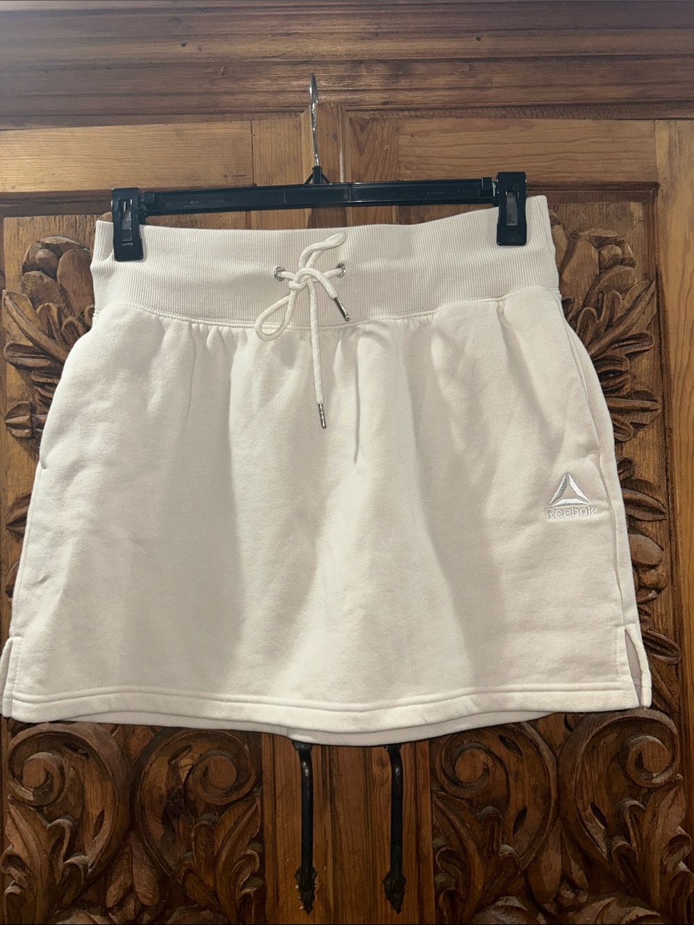 EUC Reebok large cream mini skirt